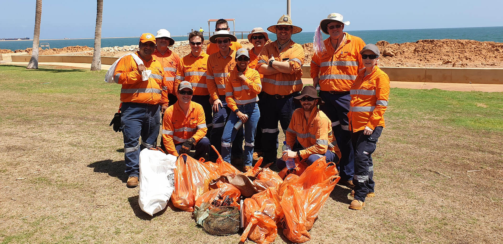 Volunteers smiling after collecting rubbish